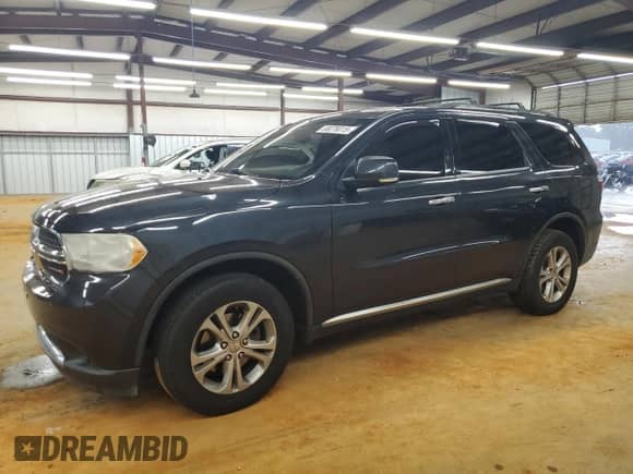 2013 Dodge Durango Crew with VIN 1C4RDJDG9DC682700, listed as a Copart auction lot 68078015 with 169,828 mi miles and Salvage title. Bid and sale history available at DreamBid. Image 1.