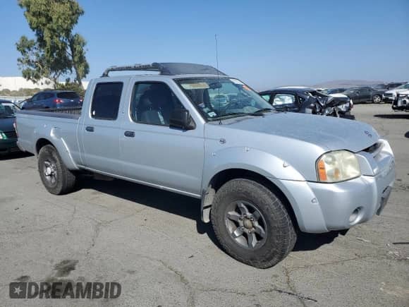 2003 Nissan Frontier XE with VIN 1N6ED29X43C434007, listed as a Copart auction lot 82172745 with 276,825 mi miles and Clean title. Bid and sale history available at DreamBid. Image 4.