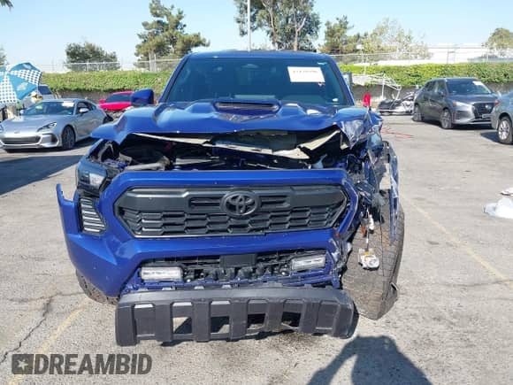 2024 Toyota Tacoma TRD Off Road with VIN 3TMLB5JN8RM074856, listed as a IAAI auction lot 43139396 with 8,137 mi miles and . Bid and sale history available at DreamBid. Image 12.