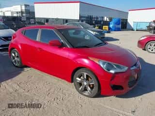 2012 Hyundai Veloster w/Gray Int with VIN KMHTC6AD0CU074696, listed as a IAAI auction lot 43383748 with 140,707 mi miles and . Bid and sale history available at DreamBid. Image 1.