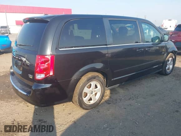 2012 Dodge Grand Caravan Crew z VIN 2C4RDGDG0CR165214, wystawiony jako IAAI lot #43256532 z przebiegiem 96 380 mil mil oraz . Historia ofert i sprzedaży dostępna na DreamBid. Obrazek 4.