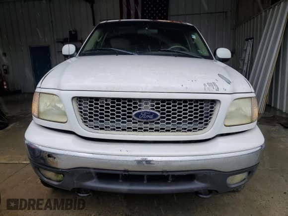 2002 Ford F-150 XLT with VIN 1FTRW08692KE20555, listed as a Copart auction lot 73571414 with 166,288 mi miles and Clean title. Bid and sale history available at DreamBid. Image 5.