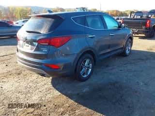 2017 Hyundai Santa Fe 2.4L z VIN 5XYZTDLB8HG457843, wystawiony jako IAAI lot #43507104 z przebiegiem 141 983 mil mil oraz . Historia ofert i sprzedaży dostępna na DreamBid. Obrazek 4.
