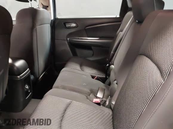 2013 Dodge Journey SE z VIN 3C4PDCAB7DT646083, wystawiony jako IAAI lot #42353530 z przebiegiem 117 965 mil mil oraz . Historia ofert i sprzedaży dostępna na DreamBid. Obrazek 8.