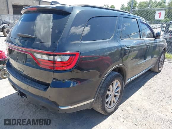 2014 Dodge Durango SXT with VIN 1C4RDJAG7EC561962, listed as a IAAI auction lot 42771485 with 179,140 mi miles and . Bid and sale history available at DreamBid. Image 4.