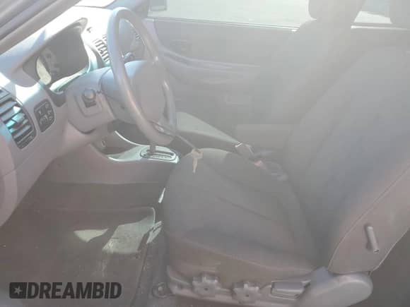 2005 Hyundai Accent GLS с VIN KMHCG35C05U331928, выставлен на аукционе Copart как лот 74672614 с пробегом 41 542 миль миль и Списание • Salvage title. История ставок и продаж доступна на DreamBid. Изображение 7.