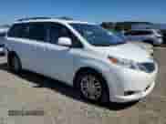 2011 Toyota Sienna XLE AAS with VIN 5TDYK3DC8BS174661, listed as a Copart auction lot 84907795 with 212,001 mi miles and Salvage title. Bid and sale history available at DreamBid. Image 4.