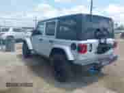 2023 Jeep Wrangler Sahara with VIN 1C4JJXP69PW695915, listed as a IAAI auction lot 42662028 with 36,957 mi miles and . Bid and sale history available at DreamBid. Image 3.