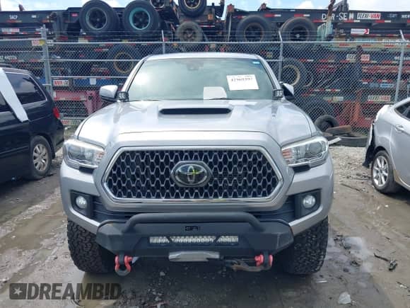 2019 Toyota Tacoma SR z VIN 3TMCZ5AN8KM287646, wystawiony jako IAAI lot #42969397 z przebiegiem 100 562 mil mil oraz . Historia ofert i sprzedaży dostępna na DreamBid. Obrazek 12.