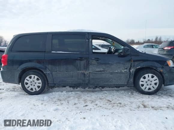 2014 Dodge Grand Caravan SXT with VIN 2C4RDGBGXER138141, listed as a IAAI auction lot 41201505 with 156,445 mi miles and . Bid and sale history available at DreamBid. Image 13.