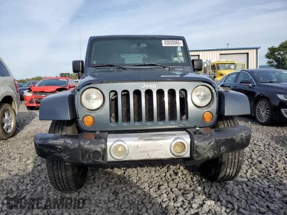 2008 Jeep Wrangler Sahara с VIN 1J8FA541X8L519597, выставлен на аукционе Copart как лот 83830965 с пробегом 141 463 миль миль и Списание • Salvage title. История ставок и продаж доступна на DreamBid. Изображение 5.