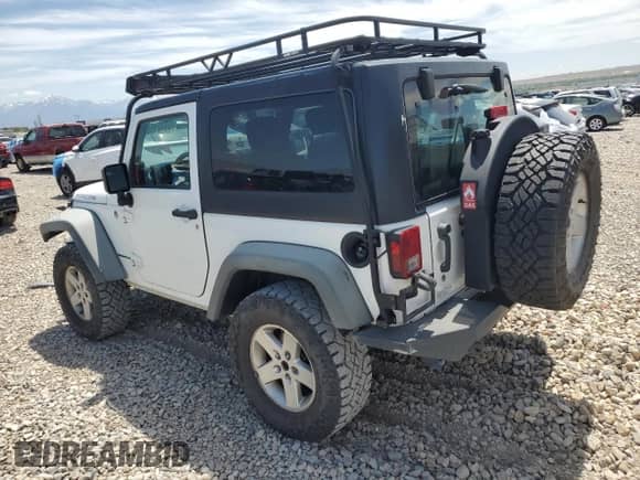 2011 Jeep Wrangler Rubicon with VIN 1J4BA6D12BL535953, listed as a Copart auction lot 59401595 with 77,451 mi miles and Salvage title. Bid and sale history available at DreamBid. Image 2.