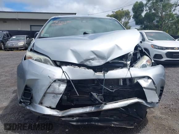 2019 Toyota Sienna L with VIN 5TDZZ3DC2KS005851, listed as a IAAI auction lot 41992778 with 99,580 mi miles and . Bid and sale history available at DreamBid. Image 12.