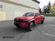 2024 Toyota Tacoma SR5 with VIN 3TYLB5JN6RT023926, listed as a Copart auction lot 90130065 with 35,061 mi miles and Salvage title. Bid and sale history available at DreamBid. Image 2.