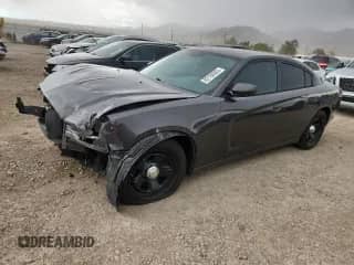 2014 Dodge Charger Police с VIN 2C3CDXAT0EH150880, выставлен на аукционе Copart как лот 82198085 с пробегом 101 083 миль миль и Списание • Salvage title. История ставок и продаж доступна на DreamBid. Изображение 1.