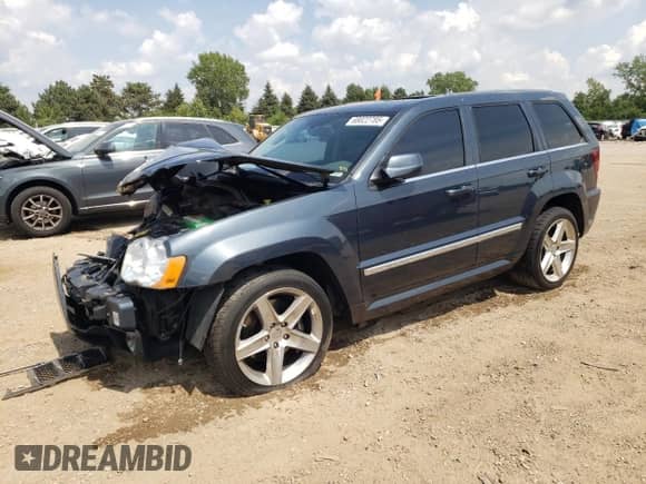 2008 Jeep Grand Cherokee SRT-8 with VIN 1J8HR78328C100958, listed as a Copart auction lot 68022785 with 151,765 mi miles and Salvage title. Bid and sale history available at DreamBid. Image 1.