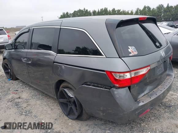 2011 Honda Odyssey LX with VIN 5FNRL5H21BB065204, listed as a IAAI auction lot 42999702 with 202,910 mi miles and . Bid and sale history available at DreamBid. Image 3.