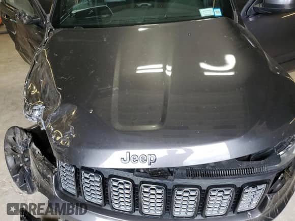 2018 Jeep Grand Cherokee Laredo with VIN 1C4RJFAGXJC487078, listed as a Copart auction lot 63752115 with 69,126 mi miles and Salvage title. Bid and sale history available at DreamBid. Image 12.