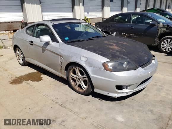 2006 Hyundai Tiburon GT с VIN KMHHN65F76U216025, выставлен на аукционе Copart как лот 74443474 с пробегом 139 626 миль миль и На запчасти • Non repairable. История ставок и продаж доступна на DreamBid. Изображение 1.