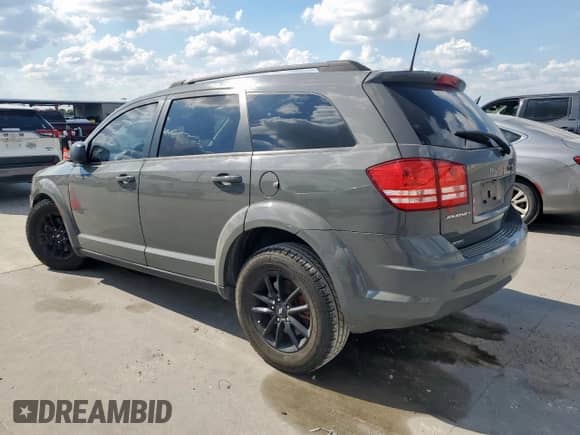 2020 Dodge Journey SE Value with VIN 3C4PDCAB0LT264587, listed as a Copart auction lot 82344675 with 124,060 mi miles and Salvage title. Bid and sale history available at DreamBid. Image 2.
