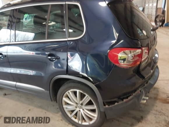 2014 Volkswagen Tiguan SEL with VIN WVGAV3AX8EW563008, listed as a IAAI auction lot 41356523 with 138,211 mi miles and . Bid and sale history available at DreamBid. Image 18.