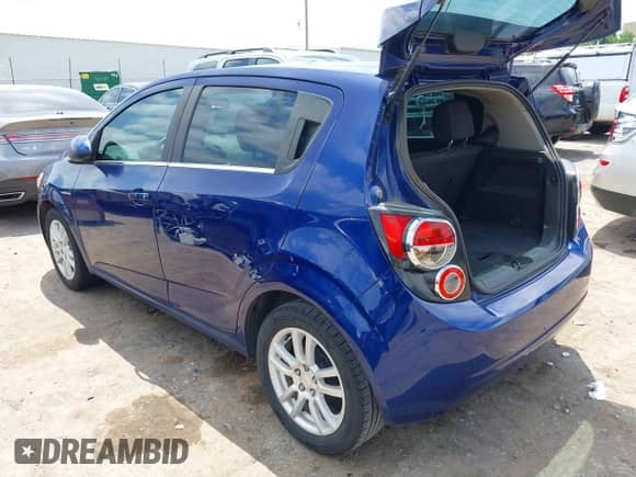 2014 Chevrolet Sonic LT with VIN 1G1JD6SBXE4170952, listed as a IAAI auction lot 42409492 with 134,049 mi miles and . Bid and sale history available at DreamBid. Image 3.