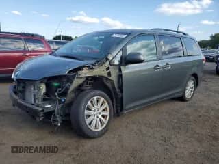 2012 Toyota Sienna XLE with VIN 5TDDK3DC0CS037018, listed as a Copart auction lot 71702205 with 174,540 mi miles and Salvage title. Bid and sale history available at DreamBid. Image 1.