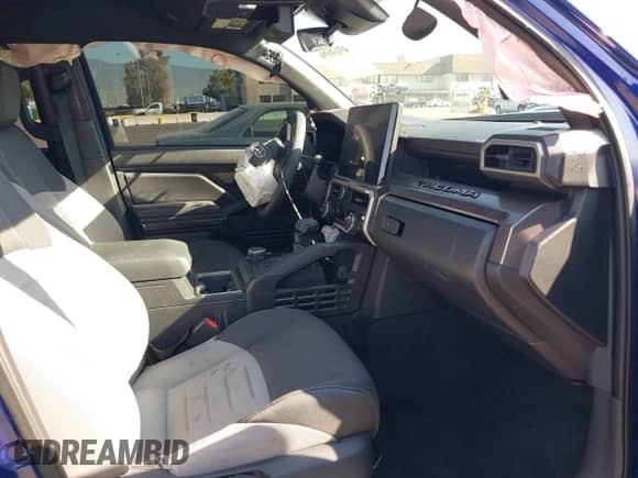 2024 Toyota Tacoma TRD Off Road with VIN 3TMLB5JN8RM074856, listed as a IAAI auction lot 43139396 with 8,137 mi miles and . Bid and sale history available at DreamBid. Image 5.
