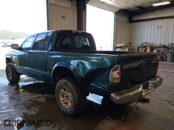 2001 Dodge Dakota Sport with VIN 1B7HG2AN31S318690, listed as a IAAI auction lot 42766545 with 212,865 mi miles and . Bid and sale history available at DreamBid. Image 3.
