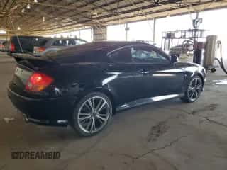 2003 Hyundai Tiburon GT с VIN KMHHN65F23U021493, выставлен на аукционе Copart как лот 68441584 с пробегом 92 848 миль миль и Чистый • Clean title. История ставок и продаж доступна на DreamBid. Изображение 3.