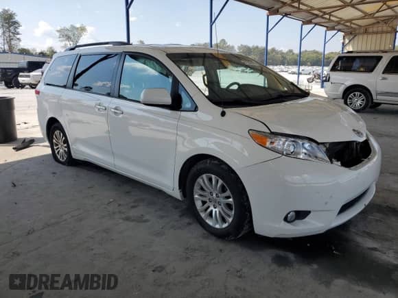 2014 Toyota Sienna XLE with VIN 5TDYK3DC2ES411861, listed as a Copart auction lot 81555925 with 184,497 mi miles and Salvage title. Bid and sale history available at DreamBid. Image 4.