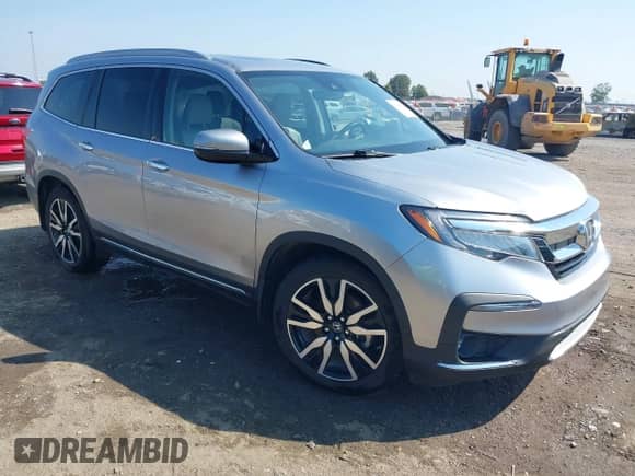 2020 Honda Pilot Touring 7-Passenger z VIN 5FNYF5H65LB025229, wystawiony jako IAAI lot #43149923 z przebiegiem 120 414 mil mil oraz . Historia ofert i sprzedaży dostępna na DreamBid. Obrazek 1.
