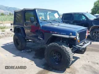 2003 Jeep Wrangler Rubicon z VIN 1J4FA69S53P324341, wystawiony jako IAAI lot #42598059 z przebiegiem 136 645 mil mil oraz . Historia ofert i sprzedaży dostępna na DreamBid. Obrazek 1.