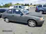 2002 Hyundai Accent z VIN KMHCF35G32U206522, wystawiony jako Copart lot #62509445 z przebiegiem 147 183 mil mil oraz Szkoda całkowita • Salvage title. Historia ofert i sprzedaży dostępna na DreamBid. Obrazek 4.