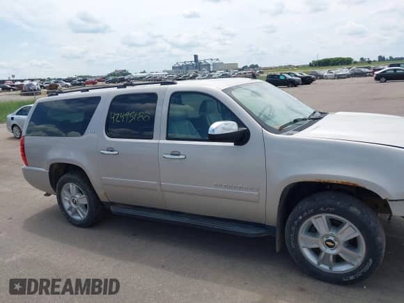 2009 Chevrolet Suburban LTZ z VIN 1GNFK36339R283999, wystawiony jako IAAI lot #42495188 z przebiegiem 203 063 mil mil oraz . Historia ofert i sprzedaży dostępna na DreamBid. Obrazek 13.