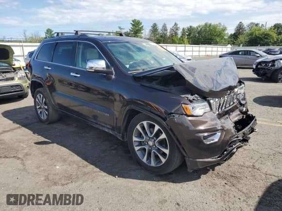 2017 Jeep Grand Cherokee Overland with VIN 1C4RJFCG4HC654896, listed as a Copart auction lot 69584085 with Not provided miles and Salvage title. Bid and sale history available at DreamBid. Image 4.