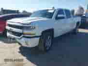 2018 Chevrolet Silverado 1500 LT with VIN 1GCUKRECXJF180945, listed as a IAAI auction lot 42450588 with 108,199 mi miles and . Bid and sale history available at DreamBid. Image 2.