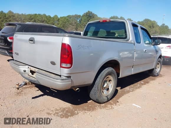 2003 Ford F-150 XL with VIN 1FTRX17233NA84161, listed as a IAAI auction lot 43456289 with 184,807 mi miles and . Bid and sale history available at DreamBid. Image 4.