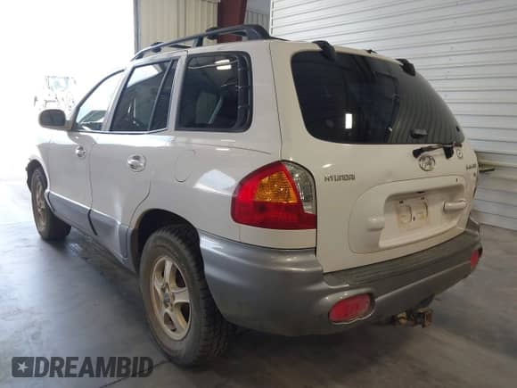 2003 Hyundai Santa Fe GLS with VIN KM8SC13D03U390028, listed as a IAAI auction lot 42476433 with 173,957 mi miles and . Bid and sale history available at DreamBid. Image 3.