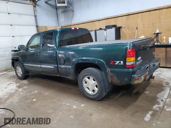 2004 GMC Sierra 1500 SLT z VIN 2GTEK19T941194072, wystawiony jako Copart lot #70002765 z przebiegiem 165 447 mil mil oraz Szkoda całkowita • Salvage title. Historia ofert i sprzedaży dostępna na DreamBid. Obrazek 2.