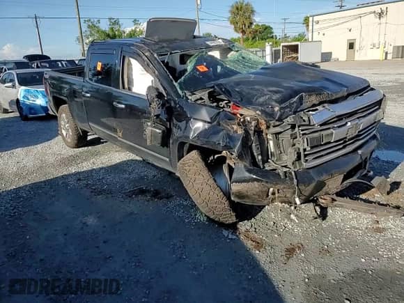 2015 Chevrolet Silverado 2500HD High Country z VIN 1GC1KXE82FF567628, wystawiony jako Copart lot #64982755 z przebiegiem Nie podano mil oraz Szkoda całkowita • Salvage title. Historia ofert i sprzedaży dostępna na DreamBid. Obrazek 14.