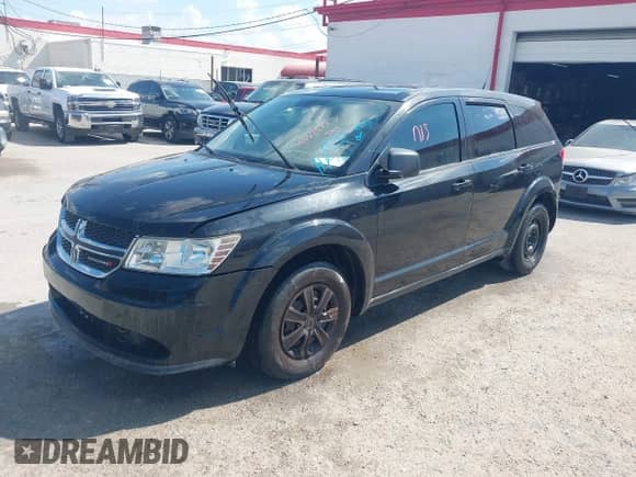 2012 Dodge Journey American Value z VIN 3C4PDCAB6CT389481, wystawiony jako IAAI lot #43359773 z przebiegiem 164 652 mil mil oraz . Historia ofert i sprzedaży dostępna na DreamBid. Obrazek 2.