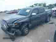 2023 Toyota Tacoma Limited with VIN 3TMEZ5CN0PM198960, listed as a IAAI auction lot 42791192 with 77,993 mi miles and . Bid and sale history available at DreamBid. Image 2.