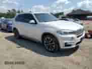 2017 BMW X5 xDrive35i with VIN 5UXKR0C51H0U54452, listed as a Copart auction lot 69730925 with 125,301 mi miles and Salvage title. Bid and sale history available at DreamBid. Image 4.