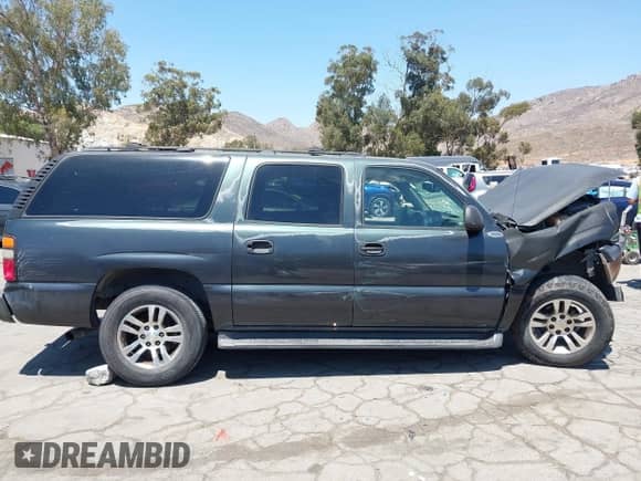 2006 Chevrolet Suburban LS 1WT z VIN 1GNEC16Z06J140083, wystawiony jako IAAI lot #42873925 z przebiegiem 254 683 mil mil oraz . Historia ofert i sprzedaży dostępna na DreamBid. Obrazek 13.