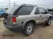 2001 Chevrolet Blazer LS z VIN 1GNCT18W61K185977, wystawiony jako Copart lot #57461385 z przebiegiem 114 357 mil mil oraz Szkoda całkowita • Salvage title. Historia ofert i sprzedaży dostępna na DreamBid. Obrazek 3.