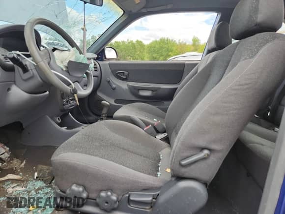 2002 Hyundai Accent GS z VIN KMHCG35C22U161535, wystawiony jako Copart lot #70580195 z przebiegiem 74 007 mil mil oraz Szkoda całkowita • Salvage title. Historia ofert i sprzedaży dostępna na DreamBid. Obrazek 7.