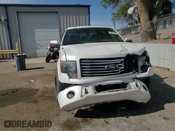 2012 Ford F-150 Lariat with VIN 1FTFW1E68CFB85590, listed as a Copart auction lot 58897445 with 131,901 mi miles and Salvage title. Bid and sale history available at DreamBid. Image 13.