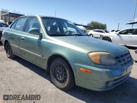 2005 Hyundai Accent GLS z VIN KMHCG45CX5U609093, wystawiony jako Copart lot #81697905 z przebiegiem 144 055 mil mil oraz Szkoda całkowita • Salvage title. Historia ofert i sprzedaży dostępna na DreamBid. Obrazek 4.