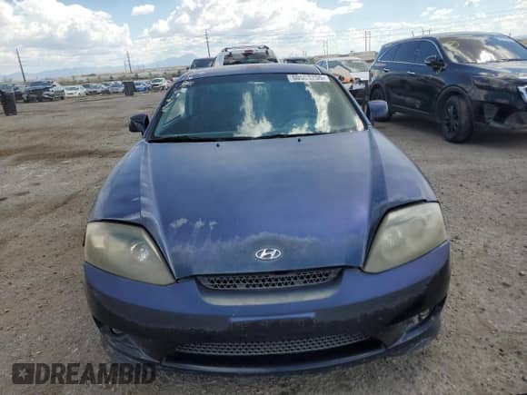 2006 Hyundai Tiburon GS с VIN KMHHM65D26U218704, выставлен на аукционе Copart как лот 80553255 с пробегом 211 718 миль миль и Списание • Salvage title. История ставок и продаж доступна на DreamBid. Изображение 5.